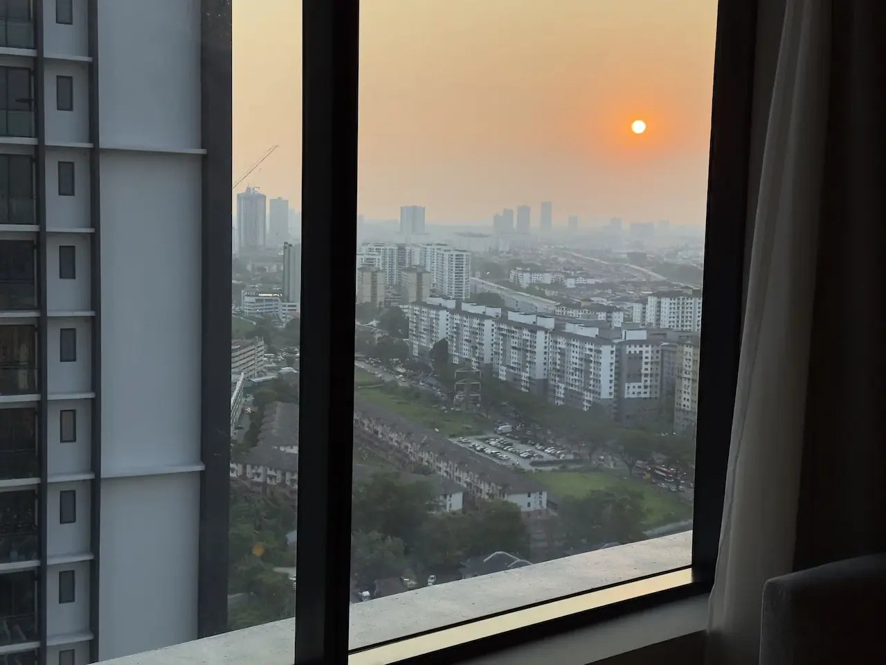 Sunset over Kuala Lumpur from a condo window, July 28, 2025