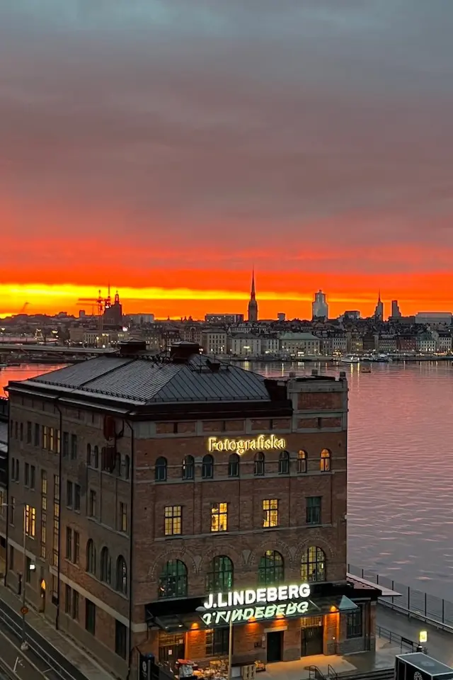My photo of Stockholm at sunset, over Fotografiska, cut to Pinterest's standard pin, 2:3 (1,000 × 1,500)