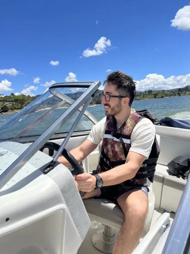 Driving a boat on the Peñol-Guatapé reservoir in May 2023