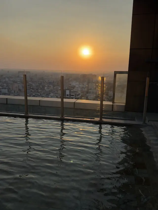 The rooftop infinity pool at sunset in Phnom Penh, January 28, 2026