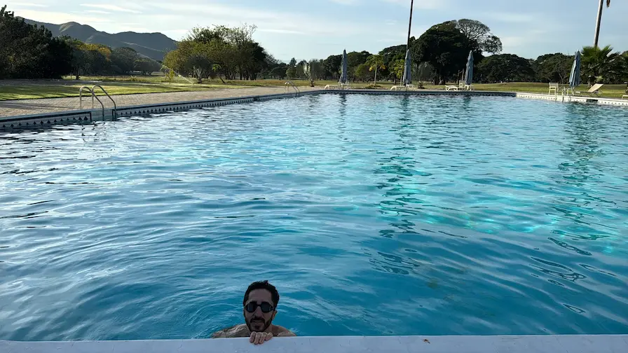 Me in the pool, the golf course behind