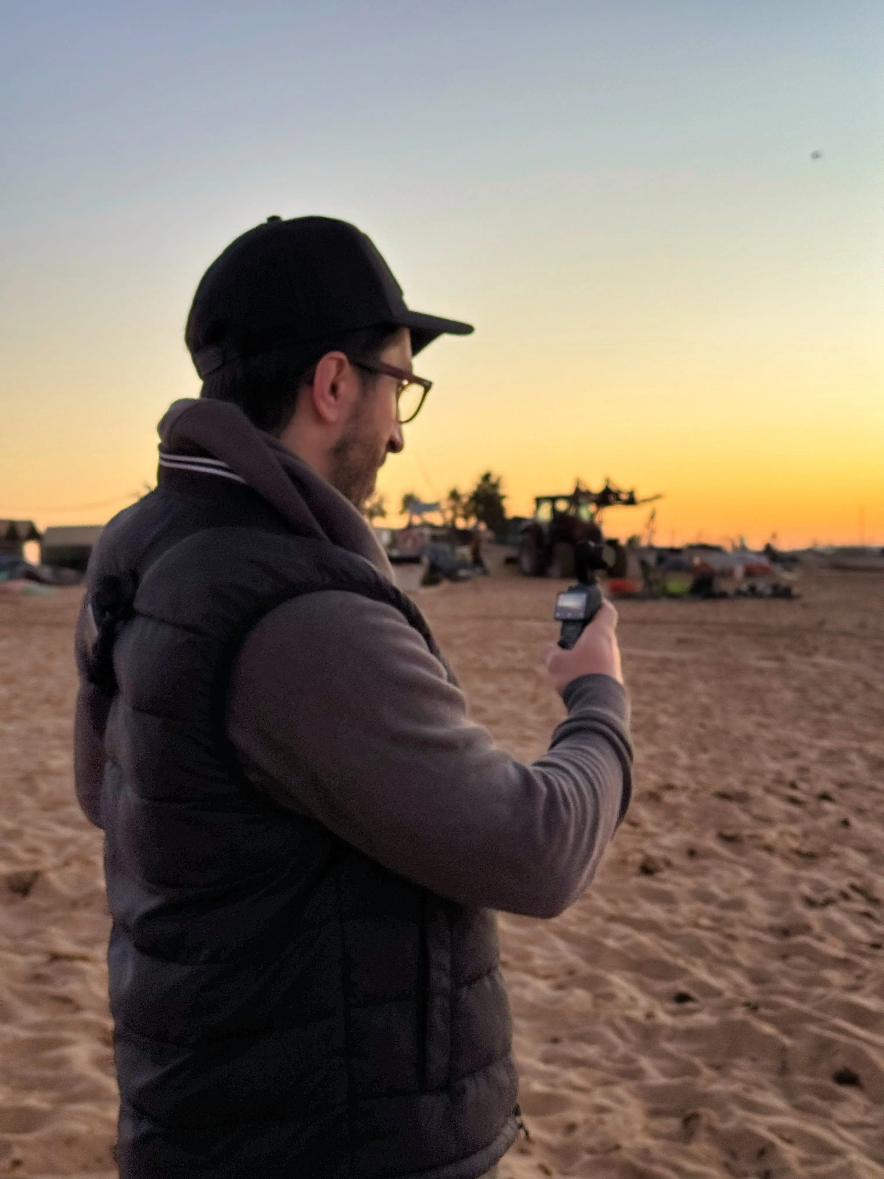 Navid Moazzez filming on a beach in the Algarve, Portugal
