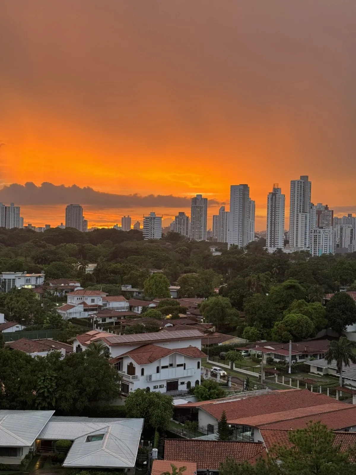 An orange sky over Panama City's skyline, May 21, 2024
