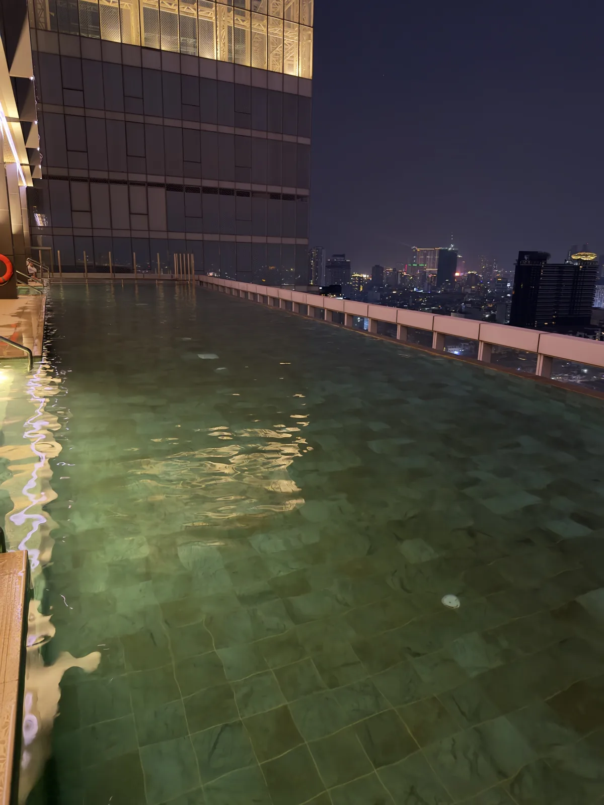 The rooftop pool at night in Phnom Penh, January 16, 2026