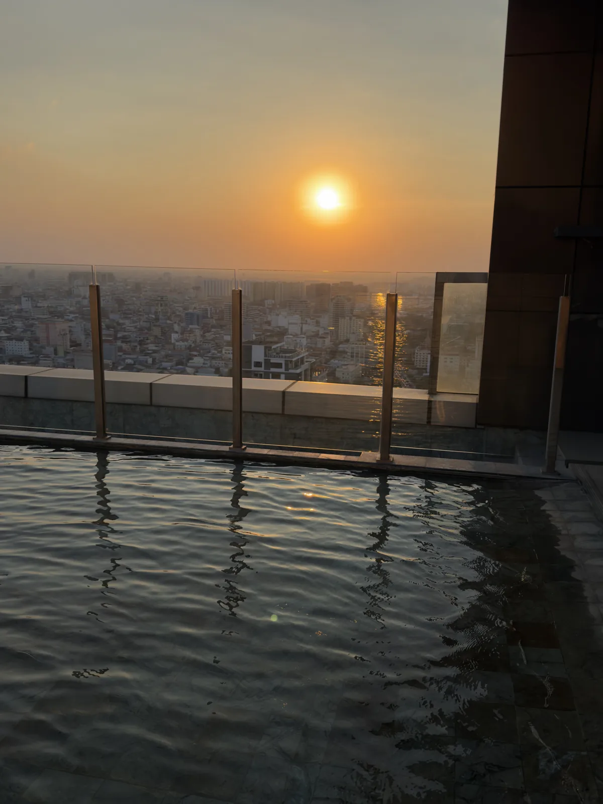 The rooftop infinity pool at sunset in Phnom Penh, January 28, 2026