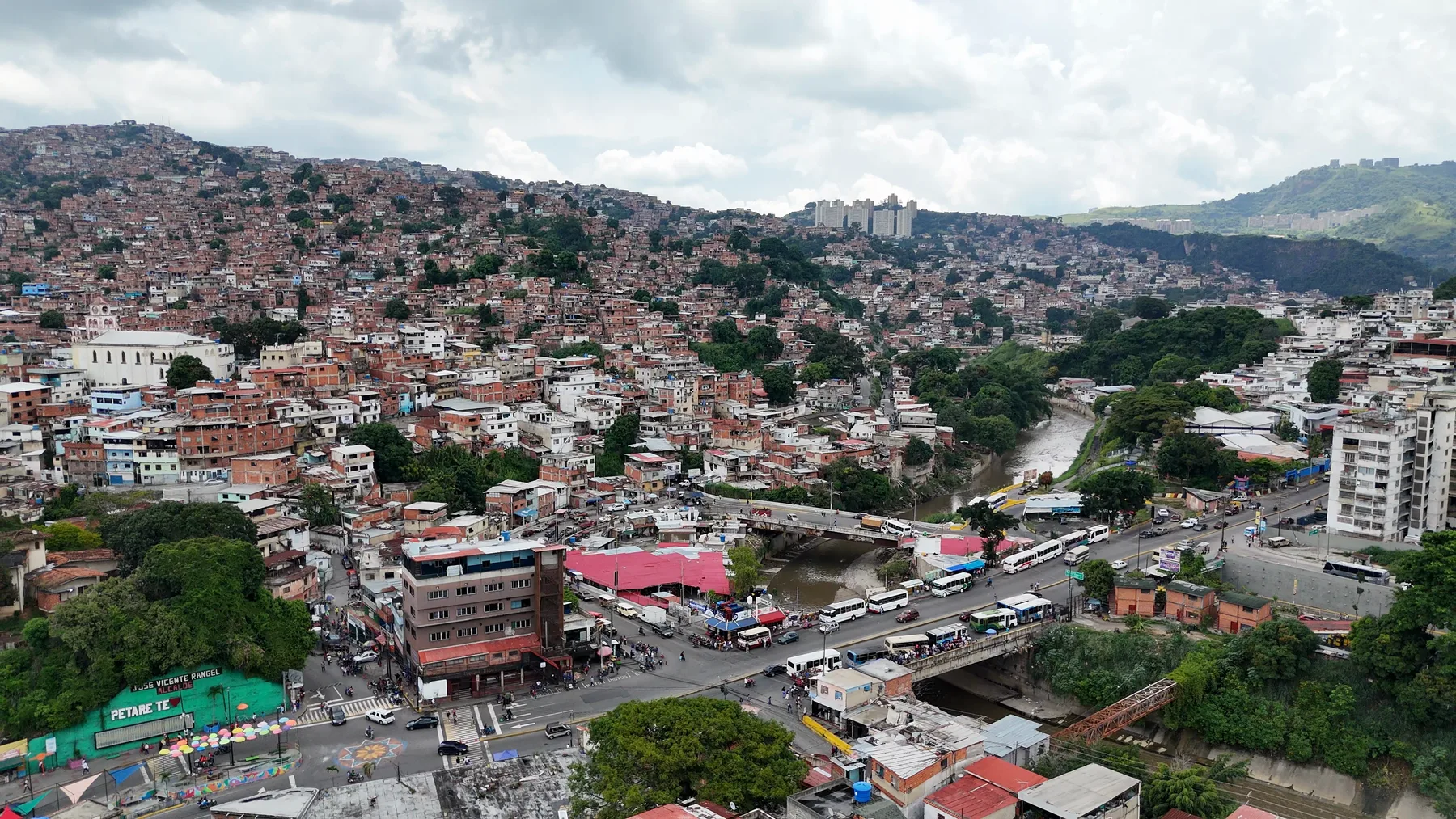Petare's hillside, the river and the old town from above